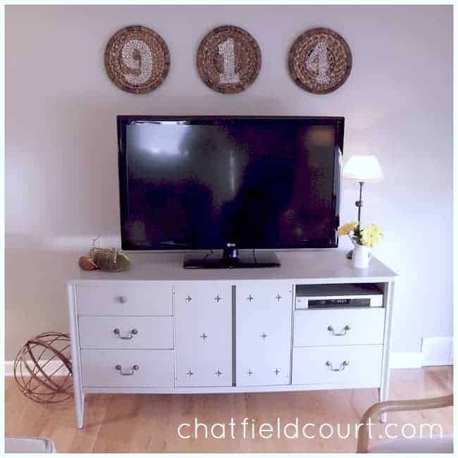 Benjamin Moore Hale Navy and brass hardware transform a vintage dresser turned media cabinet. | www.chatfieldcourt.com