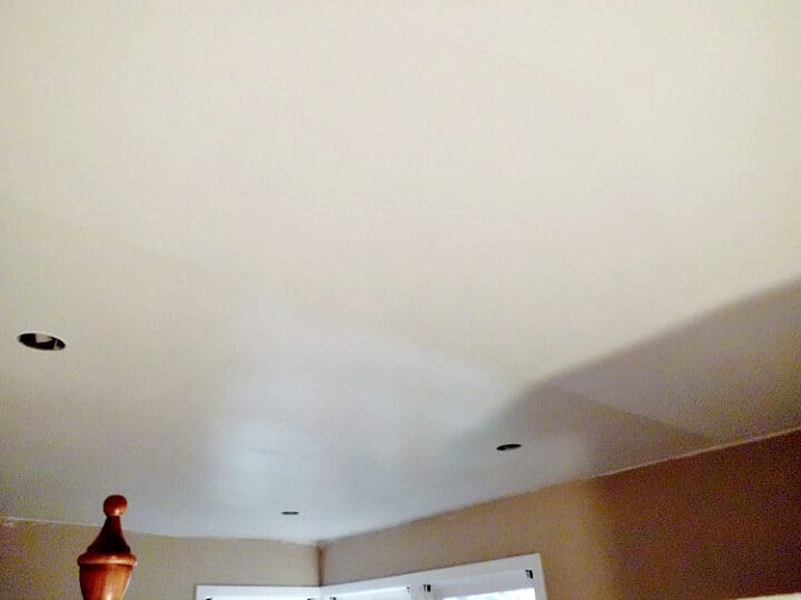 ceiling halfway painted with a pearl paint sheen