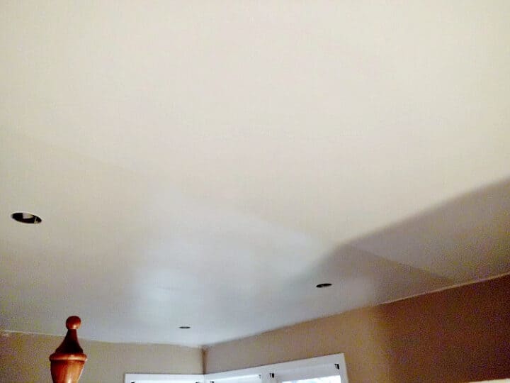 Installing Crown Molding pix ceiling halfway painted with a pearl paint sheen