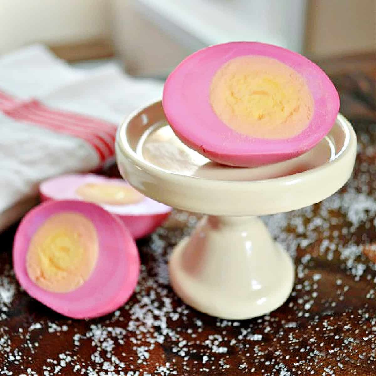 Sliced pickled eggs on a cutting board