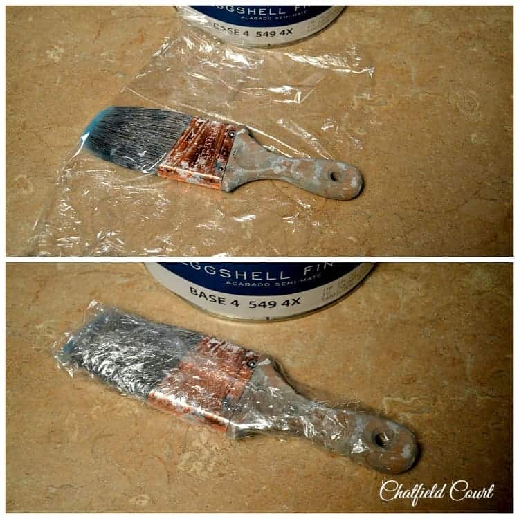 used paint brush wrapped in Saran wrap