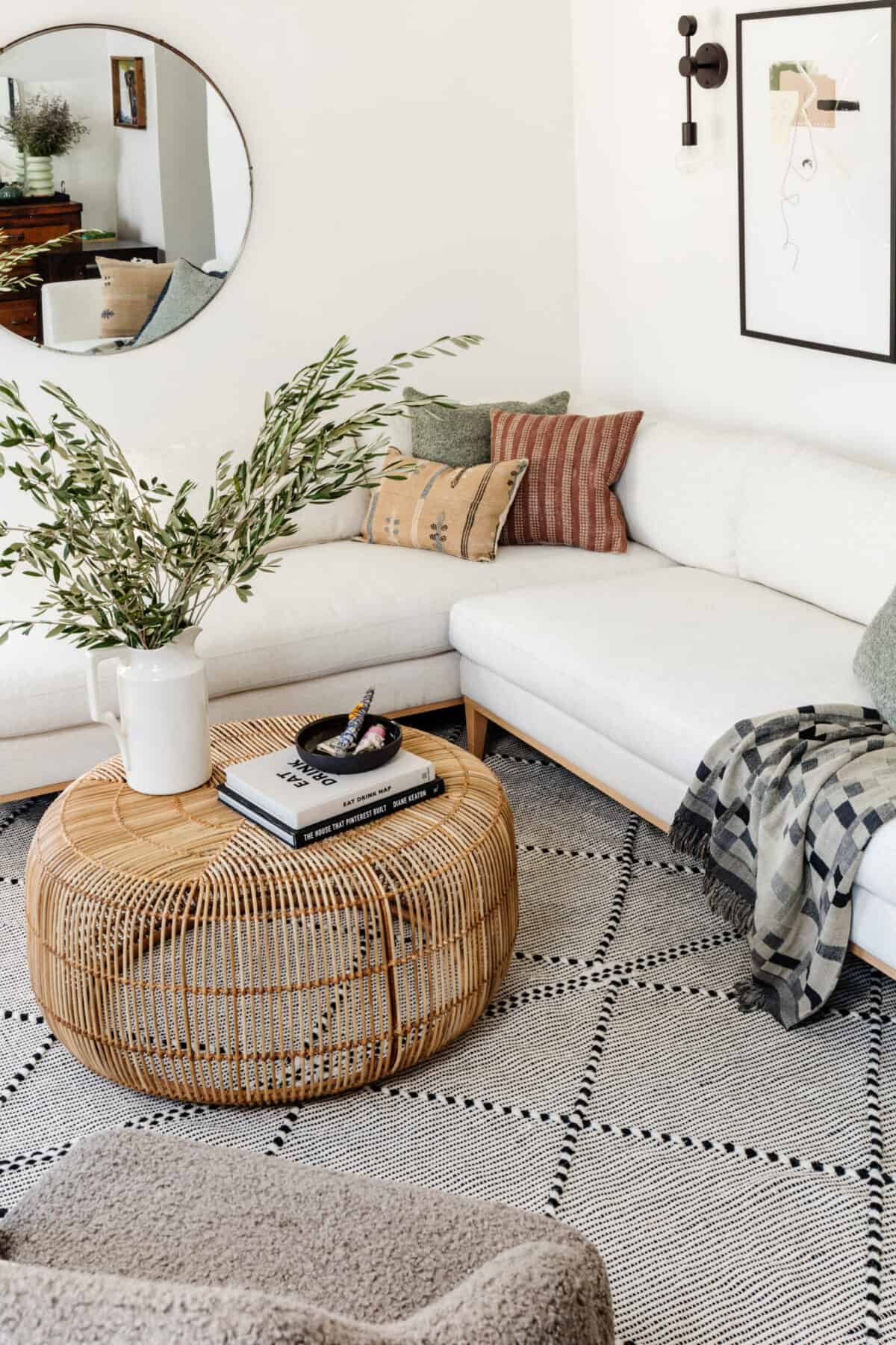 living room with white sofa and mirror