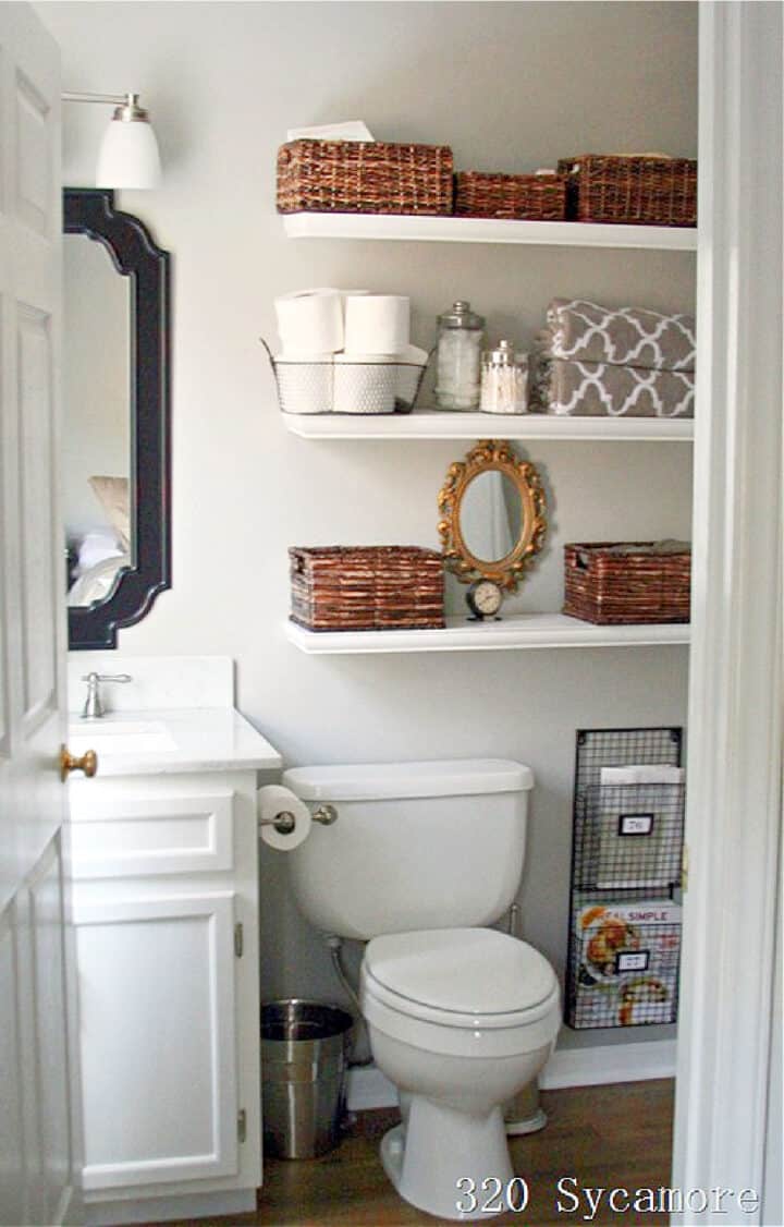 bathroom shelves in small bath filled with baskets and toiletries