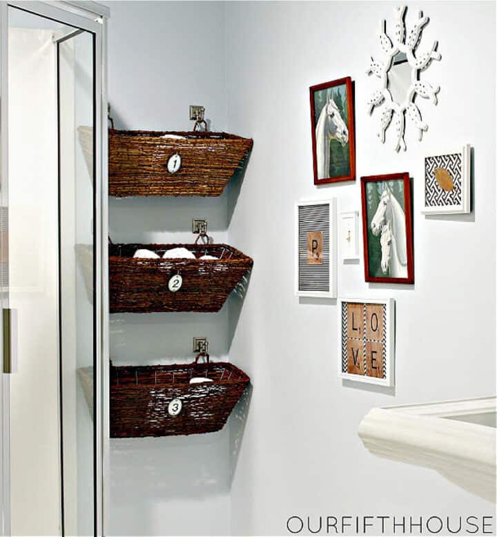 woven baskets hanging on bathroom wall with toiletries