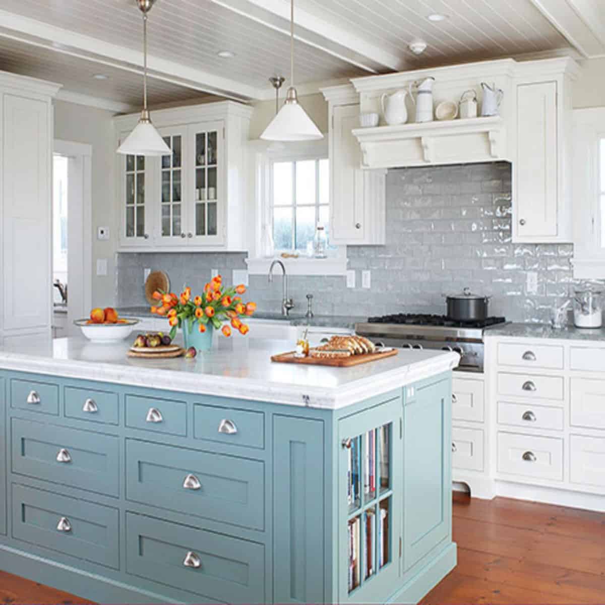 ceiling beams in white kitchen with blue island