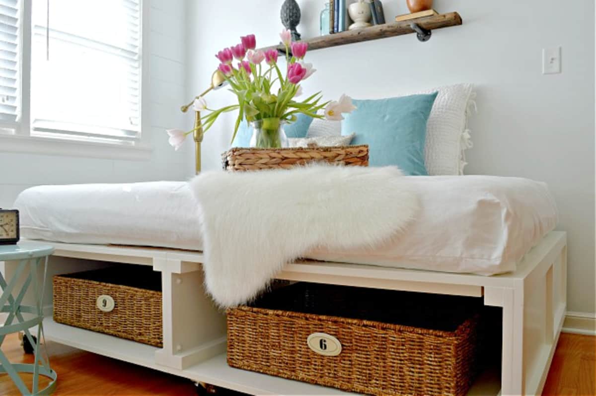 A bedroom with a platform bed