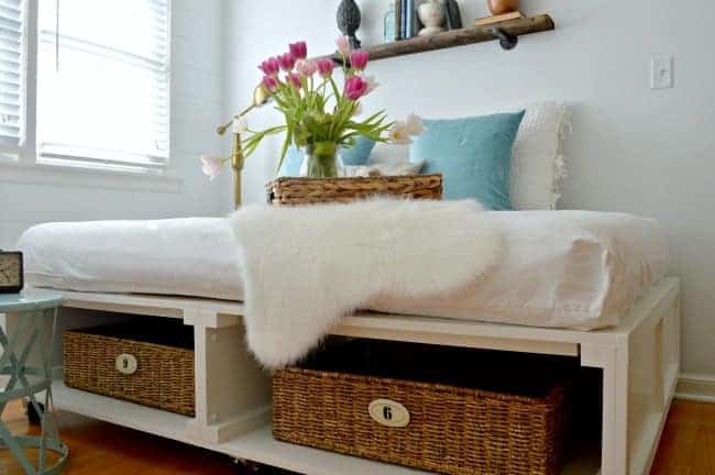 DIY platform bed with storage baskets underneath