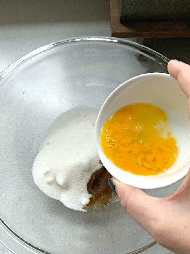 adding lightly beaten egg to peanut butter cookie batter