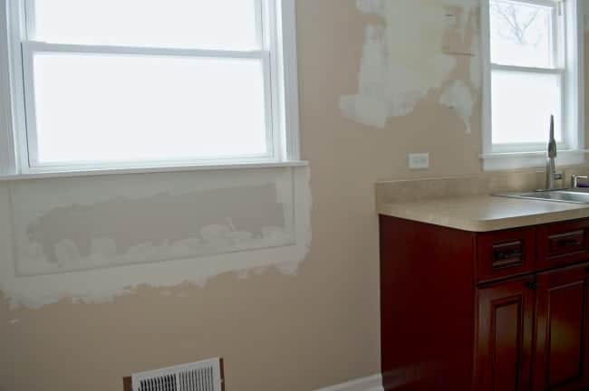 spackle on wall under window for kitchen remodel