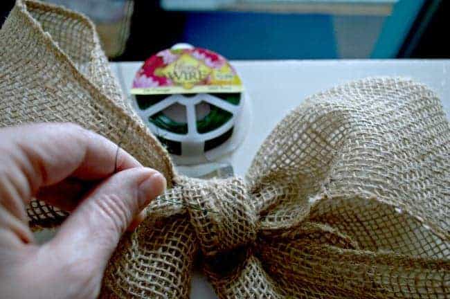 creating a burlap bow for a fall front door basket wreath