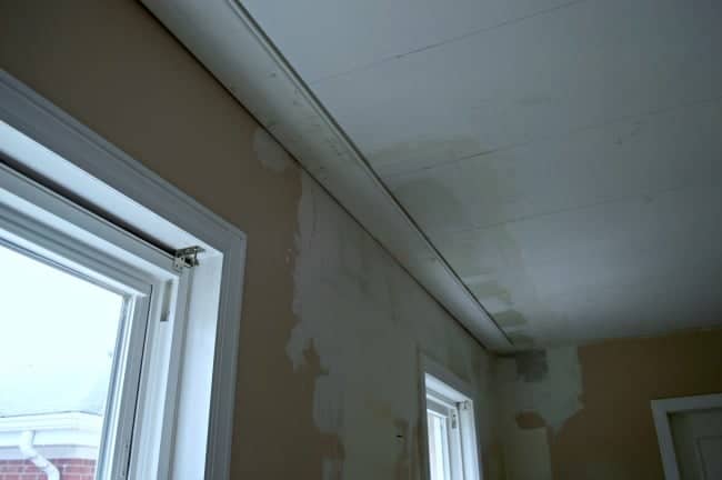 one primed tongue and groove ceiling plank installed in kitchen