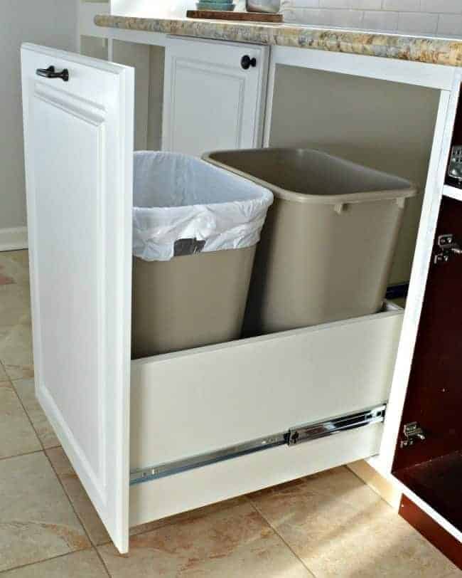 A genius kitchen storage solution...hidden trash/recycle bins with full extension drawer slides | chatfieldcourt.com