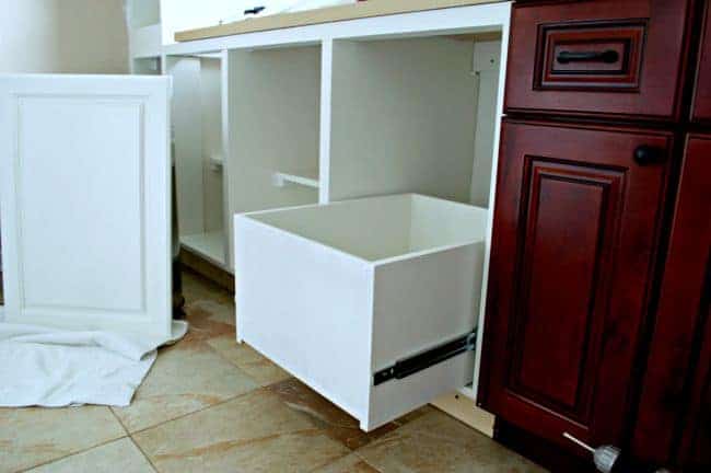 A genius kitchen storage solution...hidden trash and recycle bins in a custom-made cabinet. | chatfieldcourt.com