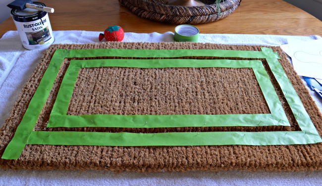 DIY deer head doormat prepping with painter's tape. | www.chatfieldcourt.com