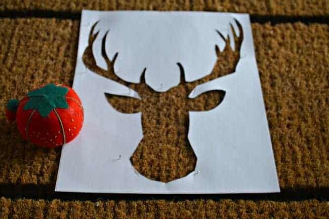 DIY deer head doormat deer head stencil pinned to mat. | www.chatfieldcourt.com