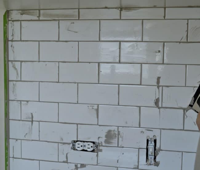 Kitchen Reno Update: Subway Tile Backsplash grouting the tile | www.chatfieldcourt.com