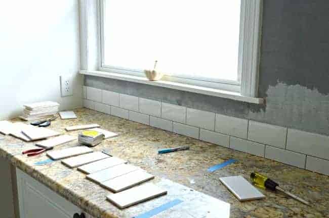 Kitchen Reno Update: Subway Tile Backsplash tile going up | www.chatfieldcourt.com