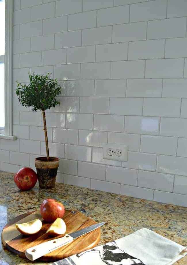 Kitchen Reno Update: Subway Tile Backsplash and warm gray grout on window wall| www.chatfieldcourt.com