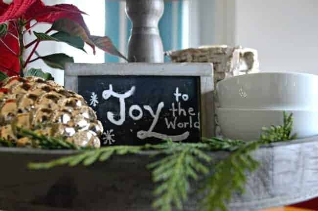 A Christmas living room and dining area decorated with lots of plaid, red and fresh greens. | www.chatfieldcourt.com