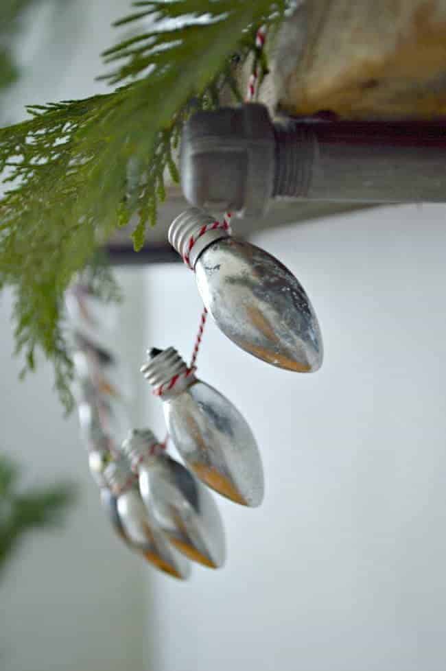 diy Christmas lightbulb banner on wood shelf