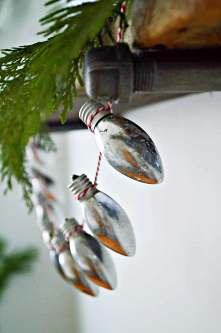 diy Christmas lightbulb banner on wood shelf