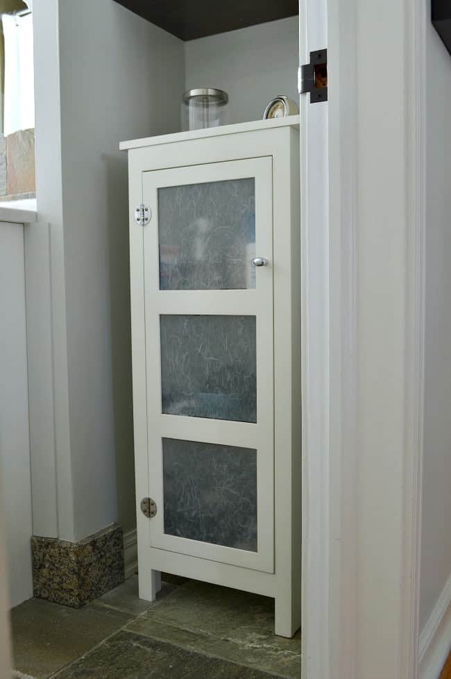 Adding a small storage cabinet can help with bathroom organization 