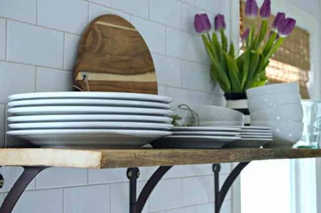 Install a rustic barn wood shelf to add extra storage in a small kitchen. | www.chatfieldcourt.com