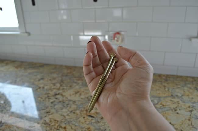 How to install a rustic barn wood shelf on a subway tiled backsplash. | www.chatfieldcourt.com