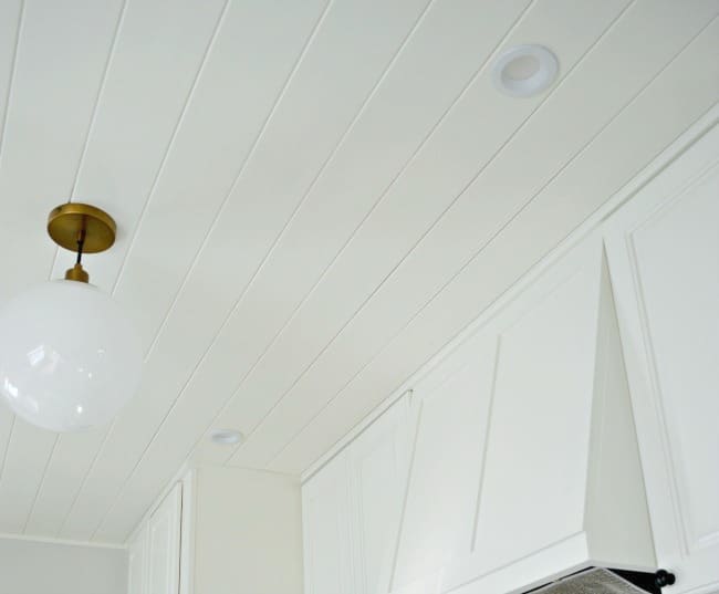 kitchen plank ceiling painted white and ceiling pendant