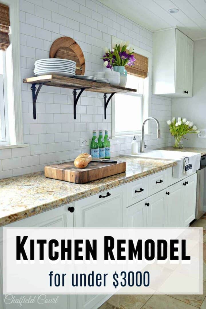 white galley kitchen counter with thick butcher block cutting board on counter