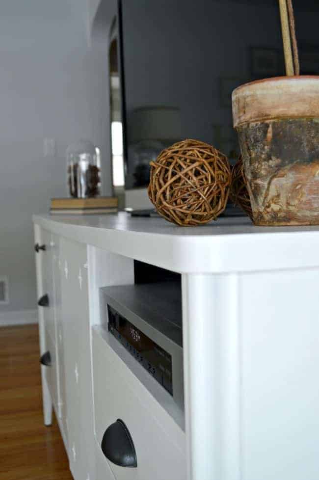 Using Benjamin Moore White Dove and cup pulls from Lowes to give a vintage dresser turned media cabinet a makeover. | www.chatfieldcourt.com