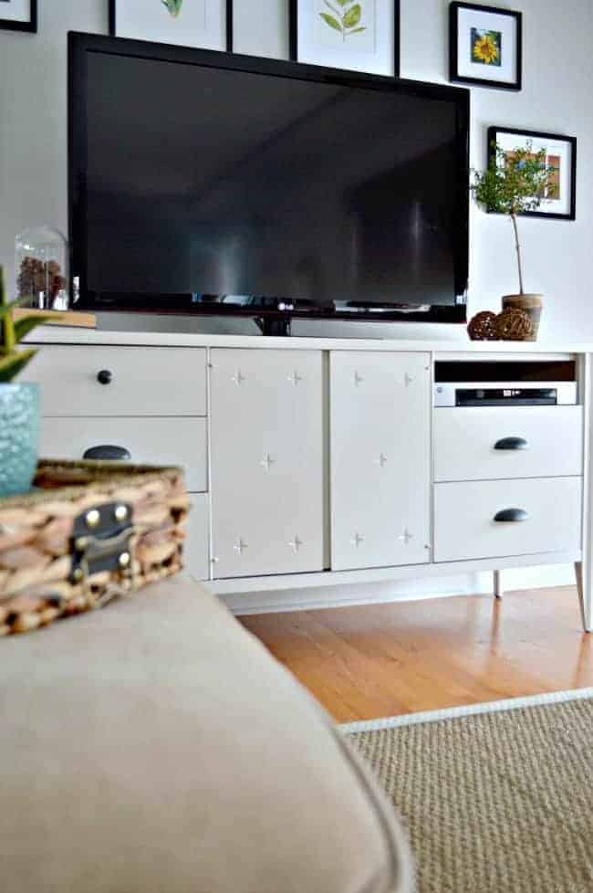 Giving a vintage dresser turned media cabinet a makeover using Benjamin Moore White Dove and cup pulls from Lowes. | www.chatfieldcourt.com