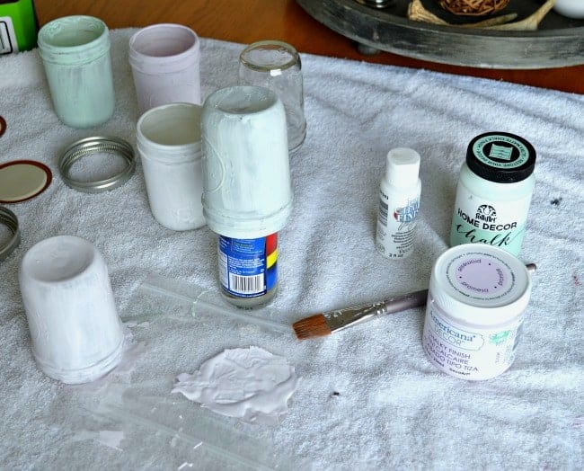 painting small mason jars with pastel chalk paint