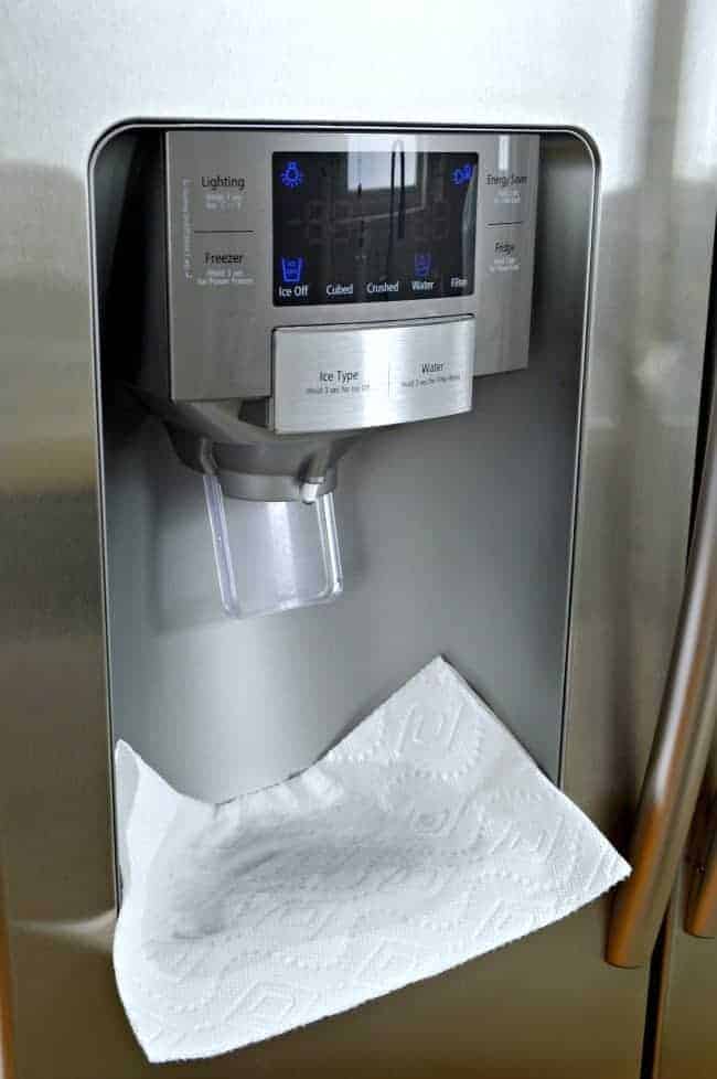 Easily remove hard water stains from your refrigerator drip tray with a towel and vinegar. | www.chatfieldcourt.com 