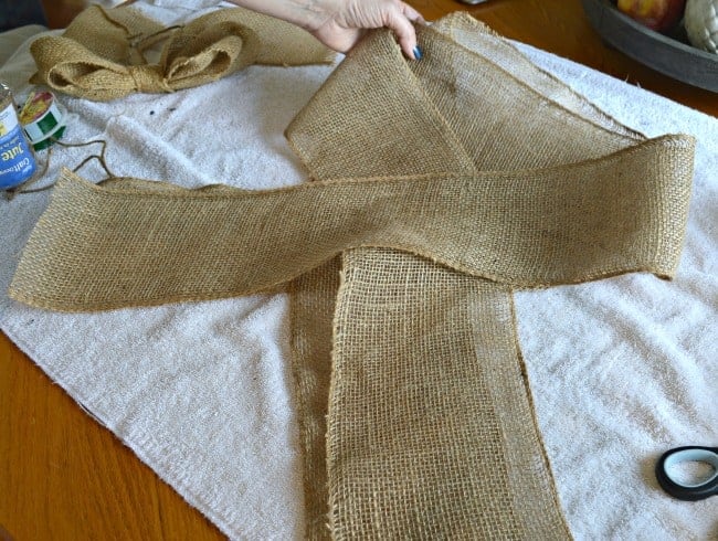 looping burlap ribbon on a table