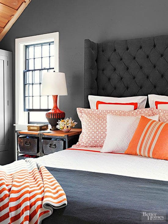 Benjamin Moore Kendall Charcoal used on a bedroom wall behind a tall upholstered headboard