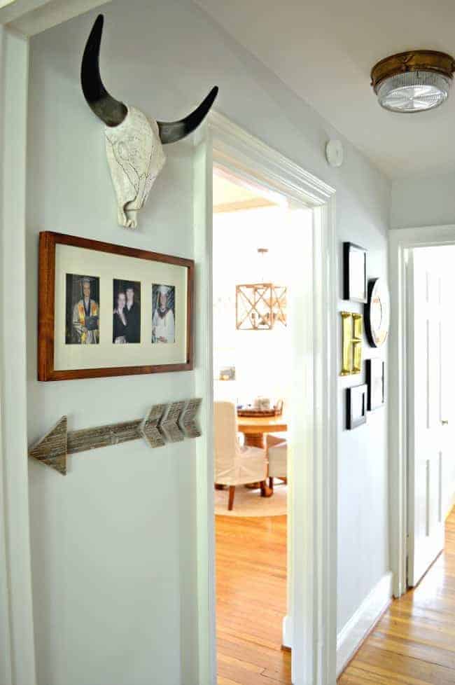 A small hallway redo using gray paint, some farmhouse decor and lots of family photos. www.chatfieldcourt.com