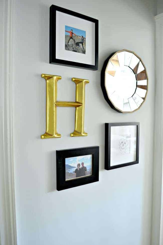 A small hallway redo using gray paint, a bit of farmhouse decor and some family photos. www.chatfieldcourt.com