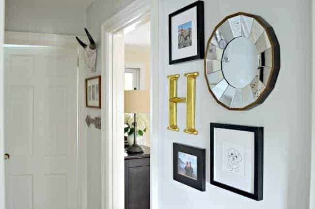 A small hallway redo using gray paint, a bit of farmhouse decor and lots of family photos. www.chatfieldcourt.com