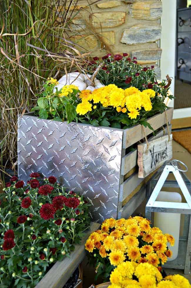 How to build a rustic, industrial wheelbarrow, a pretty fall touch for the front porch. Learn to build your own at THD DIH Workshop near you. www.chatfieldcourt.com