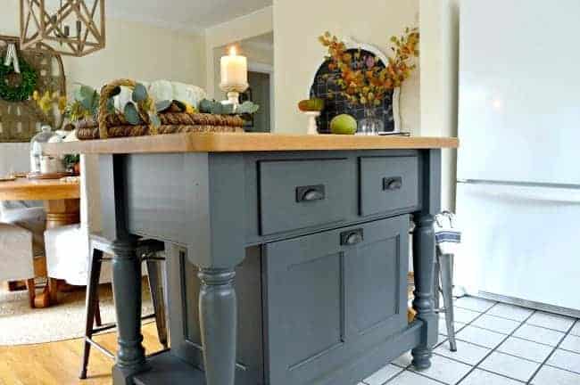 front view of gray painted kitchen island 