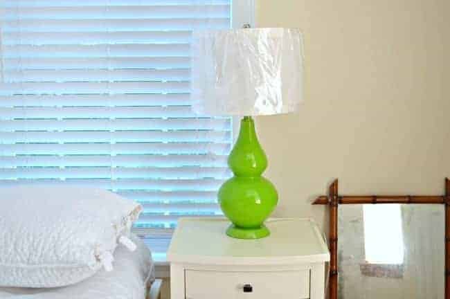 An easy and inexpensive lamp makeover using spray paint and water and vinegar to give it an aged mercury glass look.