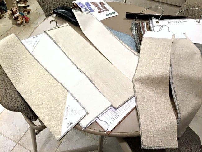 neutral sofa upholstery fabric samples laid out on table