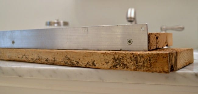 aluminum strip on back of wood shelf