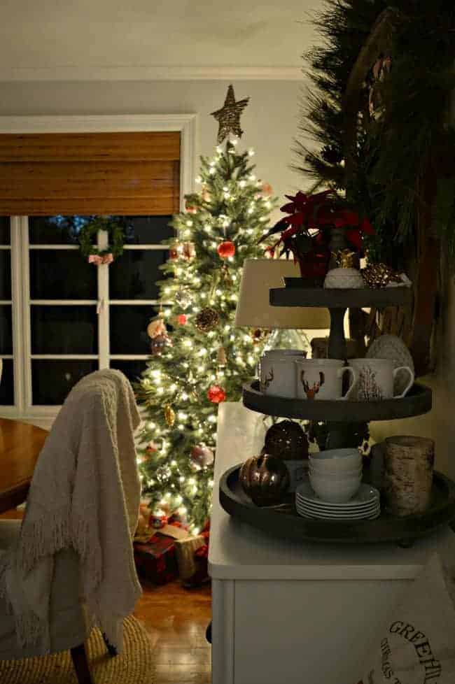 The tree at dusk in our rustic and simple cozy Christmas cottage decorated in red with touches of gold. www.chafieldcourt.com 