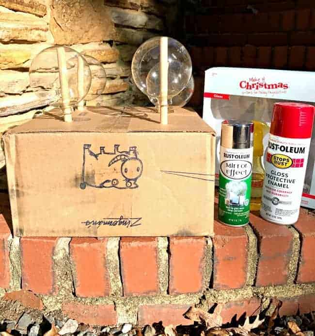 supplies to make DIY ornaments and cardboard box