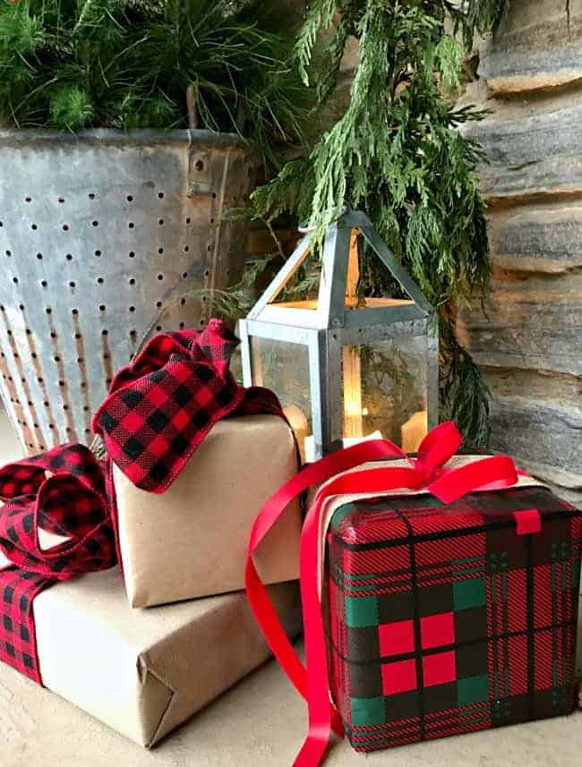 Decorating ideas for a cozy Christmas porch using fresh garland, lanterns and a few rustic touches. www.chatfieldcourt.com