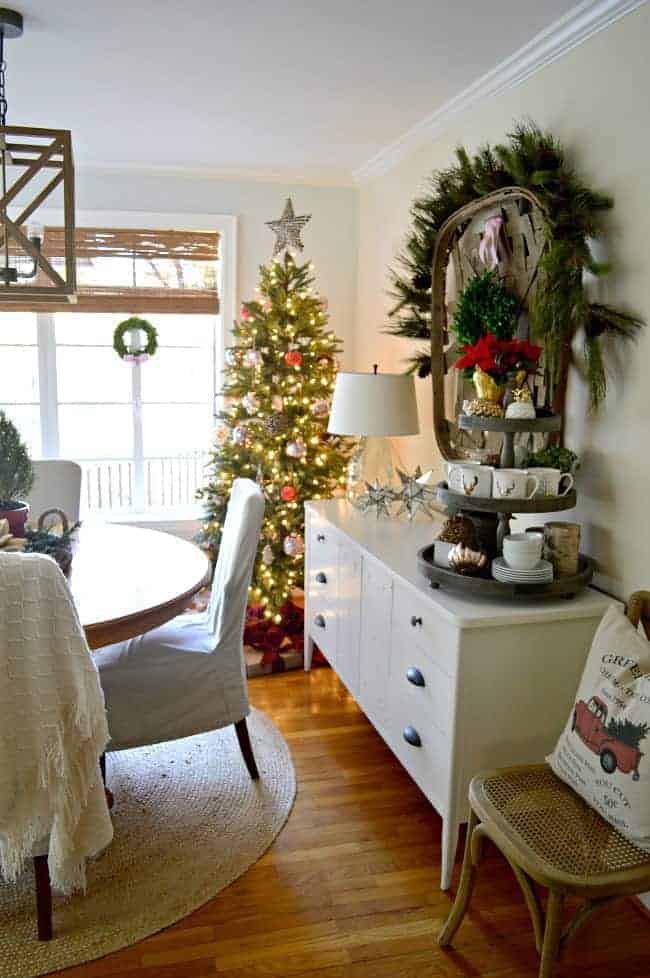 The dining room of our rustic and simple cozy Christmas cottage decorated in red with touches of gold. www.chafieldcourt.com 