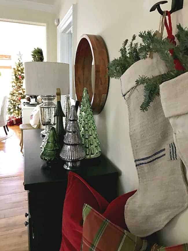 The entryway of our rustic and simple cozy Christmas cottage decorated in red with touches of gold. www.chafieldcourt.com 