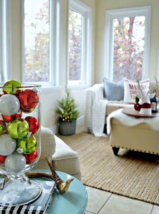 The sunroom in our rustic and simple cozy Christmas cottage decorated in red with touches of gold. www.chafieldcourt.com 